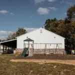 Playground beside a large building.