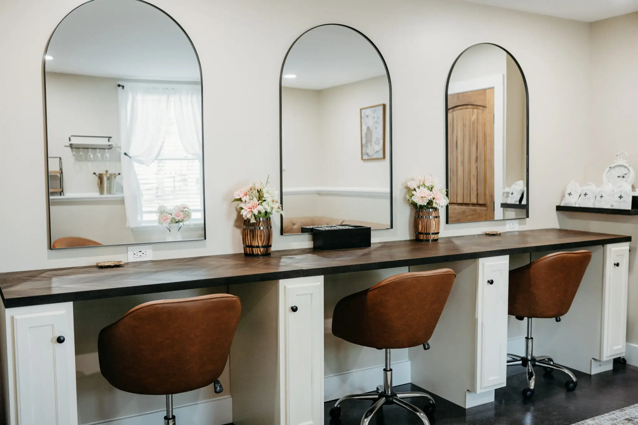 Elegant vanity area with mirrors.