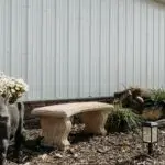 Decorative cow and stone bench