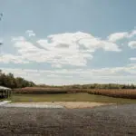 Open field under a blue sky.